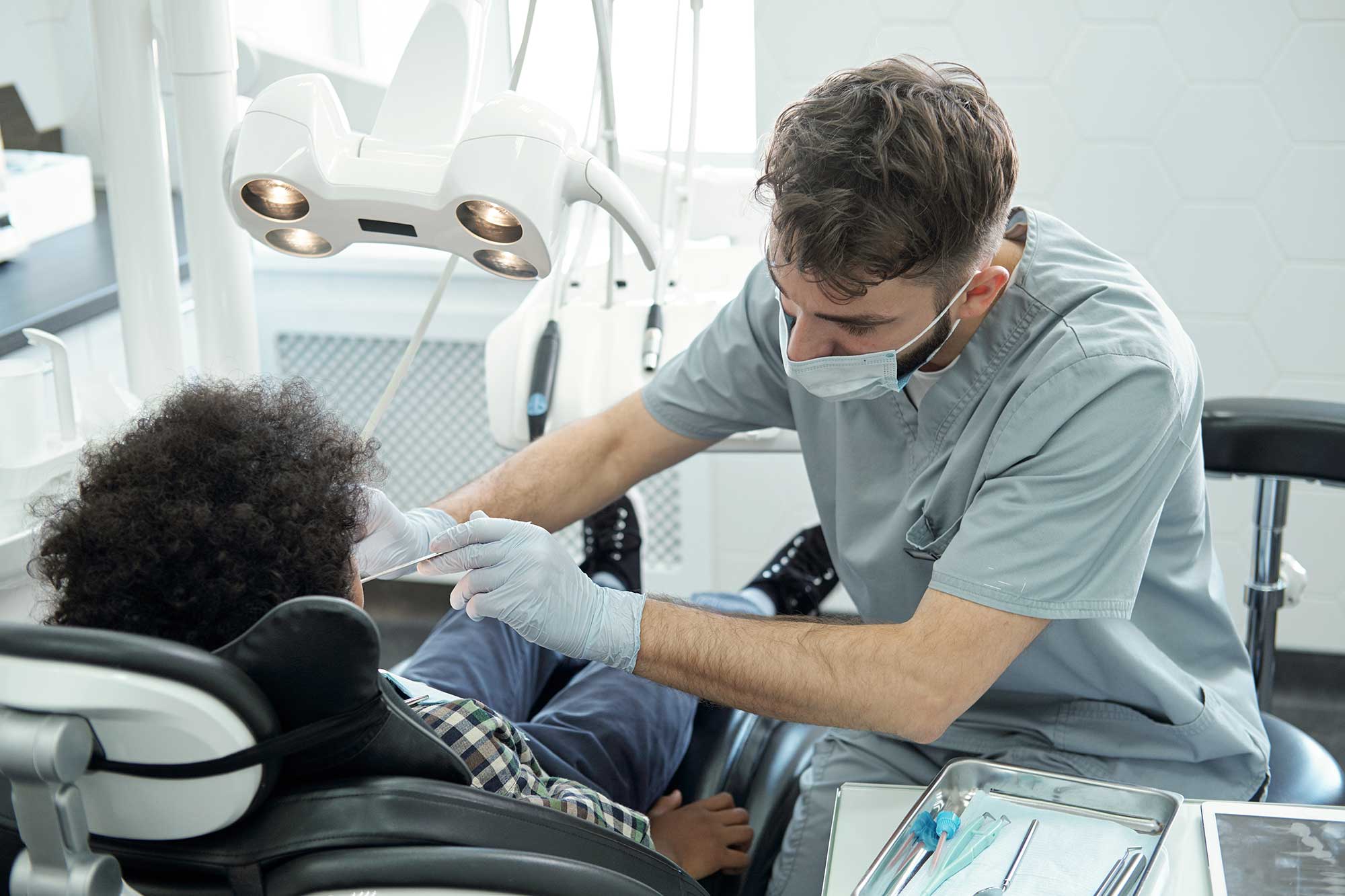 dentist working on a patient from an angle