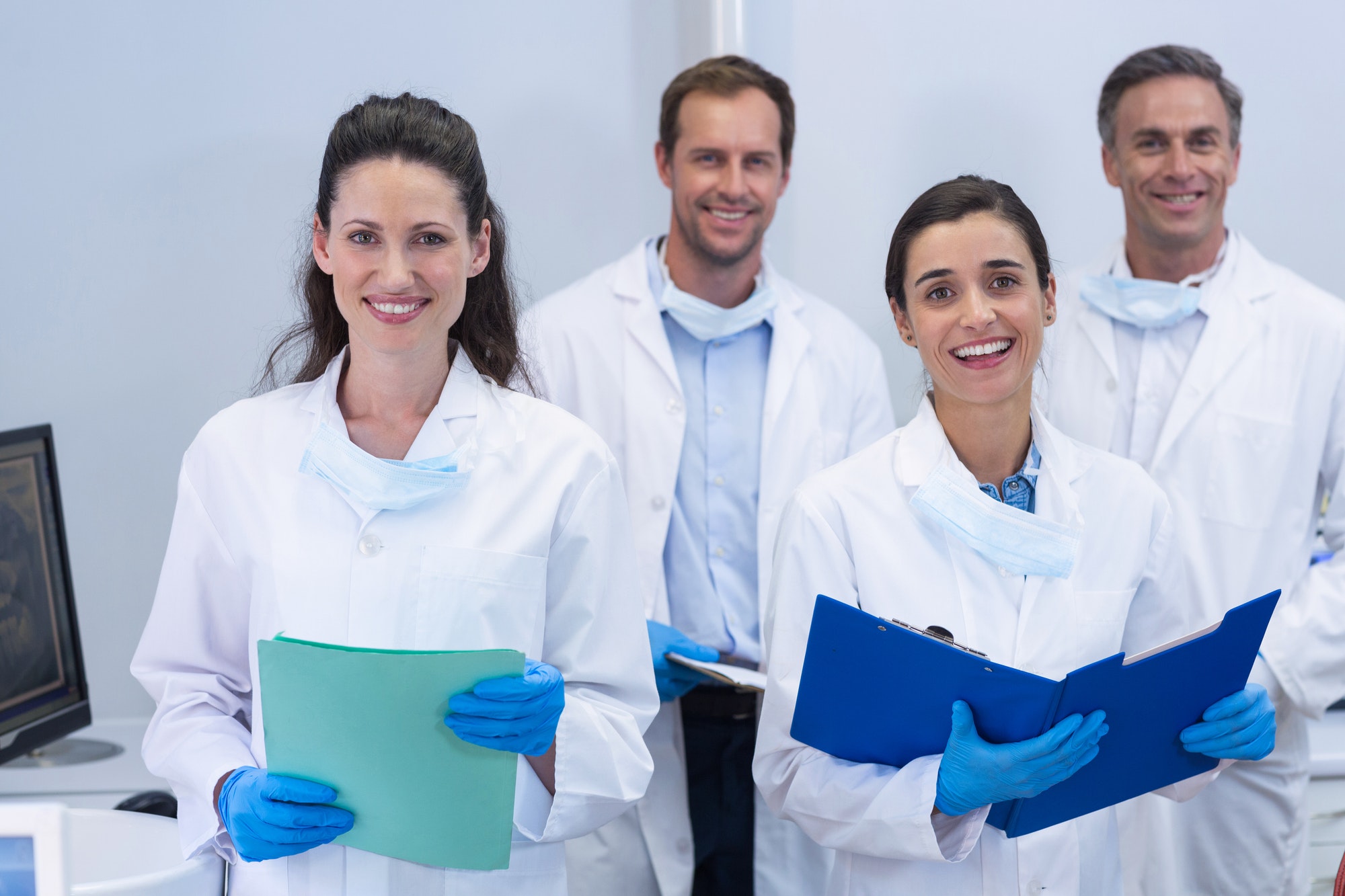 smiling dentist team welcomes you